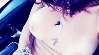 Vanessa Vixon indulges in solo fetish masturbation, playing with her big tits and pussy.