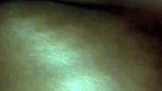 rubbing body oil on a black milf during massage