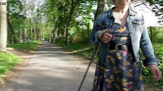 Public display of the hairy mature in transparent dress in the park