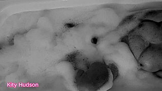 KITY HUDSON ENJOYS BATH WITH TOY