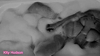 KITY HUDSON ENJOYS BATH WITH TOY