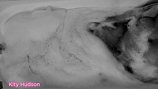 KITY HUDSON ENJOYS BATH WITH TOY