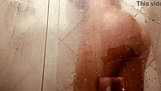 A mature beauty washes her hairy genitals in the bathroom