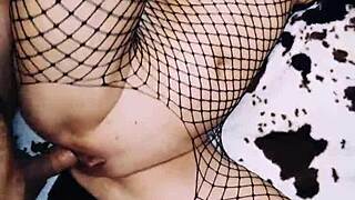 A wife in an erotic fishnet bodysuit beautifully spreads her legs