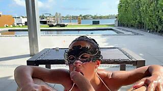 Mom gives an oiled up blowjob by the pool