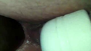 Wife takes a big black cock in her rear while using her wand toy