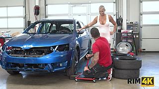 Big-boobed blonde gets rim job in car shop