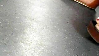 mature feet captured candidly in wedges sandals