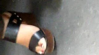 mature feet captured candidly in wedges sandals