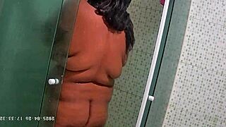 Hidden camera catches Brazilian neighbor shaving her big natural tits and ass.