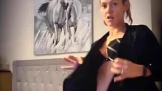 Blonde Woman Teasing With Undressing Striptease