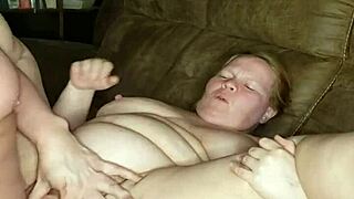 The pregnant milf, horny and wet, gets fucked on the couch