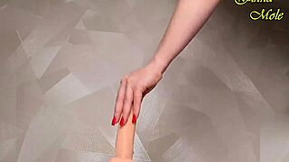 hot milf in red fishnets sets up dildo for a long, wet ride on monster cock