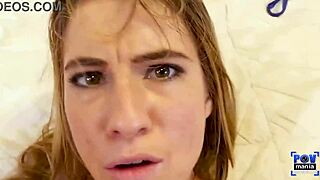 Tara Ashley stares at the camera while riding Lucky Miles long.