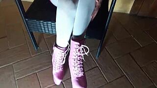 sitting on a chair in pantyhose and high heeled boots