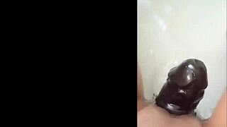 Latina milf plays with shaved pussy using nice dildo