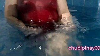 Asian milf flashes big natural tits at public pool