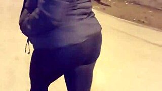 mature whore flashes thong in transparent leggings outdoors