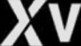 alluring brunette beauty shows off stunning figure on sofa.