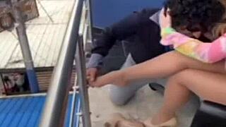 Pierced woman in pantyhose with milf allure.