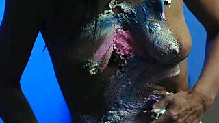 Messy birthday cake girl plays with food on natural tits