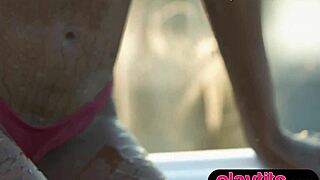 petite ebony milf strips down in the pool, showing off her juicy tits