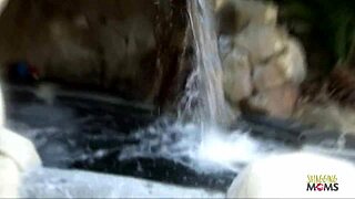 Brunette Poses By Waterfall Before Receiving Facial