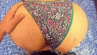 Woman surprised while relaxing in the pool water