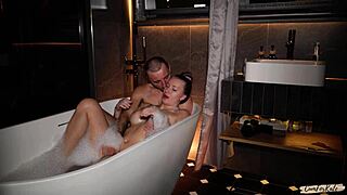 I help my stepmom relax and fuck her in hot bathtub