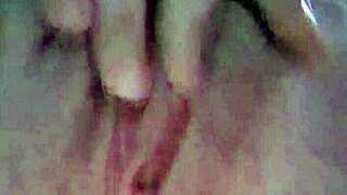 my wife sets up the camera in our bedroom and starts touching herself slowly, building up to a shaking orgasm all alone