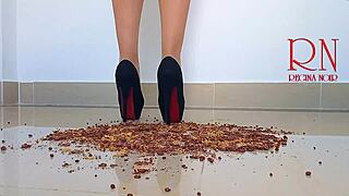 Brunette curvy femdom in boots and lingerie destroys cornflakes with high heels on dorm floor. Party maid scene with gaping and submissive naked action.