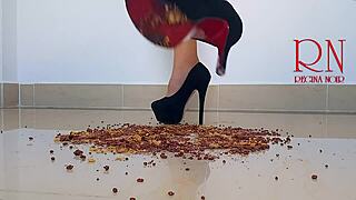 Brunette curvy femdom in boots and lingerie destroys cornflakes with high heels on dorm floor. Party maid scene with gaping and submissive naked action.
