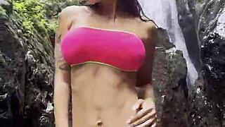 Monika Fox Wanders Jungle in Pink Top Yellow Shorts Revealing Pierced Nipples and Tattoos Solo