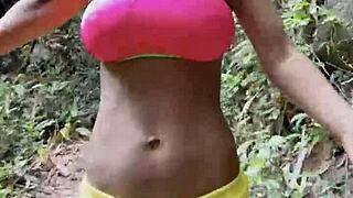 Monika Fox Wanders Jungle in Pink Top Yellow Shorts Revealing Pierced Nipples and Tattoos Solo