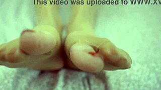 Dominant sexy blonde demands cum on her nylon-covered feet after intense foot fetish play.