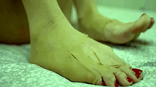 Dominant sexy blonde demands cum on her nylon-covered feet after intense foot fetish play.