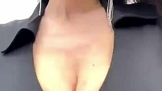 stepmother with big boobs walks outside, showing off her natural tits in public