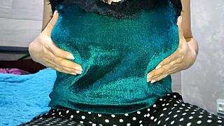 one amateur at home casually plays with her big boobs in a solo session