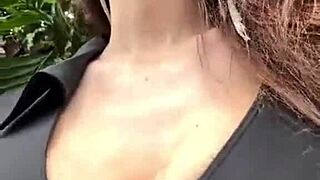 stepmother with big boobs walks outside, showing off her natural tits in public