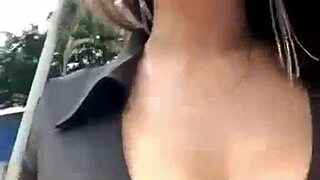 stepmother with big boobs walks outside, showing off her natural tits in public