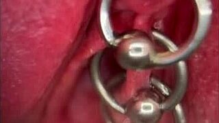 Close-up shows my pissing shaved pussy with pierced clit in outdoor solo moment.