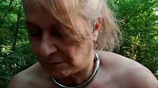 French maid slave bound in handcuffs for public outdoor humiliation spanking and facial cumshot in forest