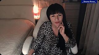 Brunette milf in lingerie strips to reveal perky small tits and swollen clit.