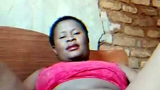 Hubby gone—watch this sexy African milf finger her dripping wet pussy teasingly!