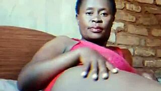 Hubby gone—watch this sexy African milf finger her dripping wet pussy teasingly!