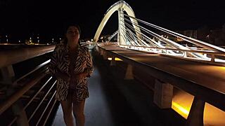 oh man luscious milf struts braless pantyless on bridge flashing huge tits