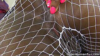 British Black Mama Milf Fingers Mature Pussy in Fishnets