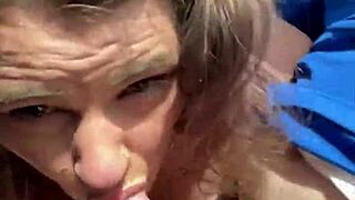 topless hooker rubs cum on face after deepthroat load in mouth