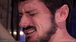 bound busty milf whips slave then pegs his ass hard in bizarre femdom dungeon