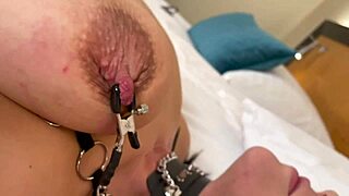 He torments her bound dark nipples with hard squeezes and stretches